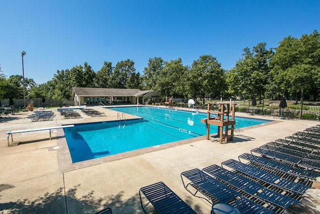 9334 Royal Mountain Dr, Chattanooga, TN 37421 - community pool featuring a patio and view of wooded area