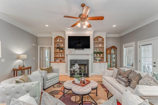 27 Bluff Mountain Dr, Rome, GA 30165 - living room with light wood-type flooring, a ceiling fan, a fireplace, ornamental molding, and recessed lighting