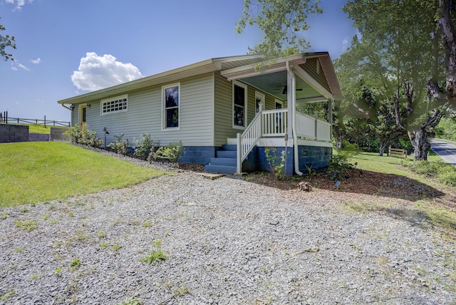 109 S Clear Springs Rd, Limestone, TN 37681 - view of front facade with a ceiling fan, covered porch, and gravel driveway