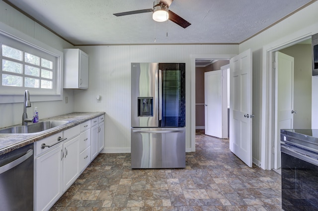 109 S Clear Springs Rd, Limestone, TN 37681 - kitchen featuring stainless steel appliances, a sink, crown molding, ceiling fan, and white cabinetry