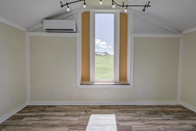 109 S Clear Springs Rd, Limestone, TN 37681 - additional living space with a wall mounted air conditioner, vaulted ceiling, wood finished floors, and baseboards