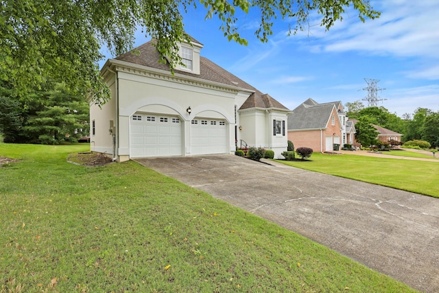 8207 Carriage Xing, Chattanooga, TN 37421 - view of front of house with driveway, a front yard, a garage, and stucco siding