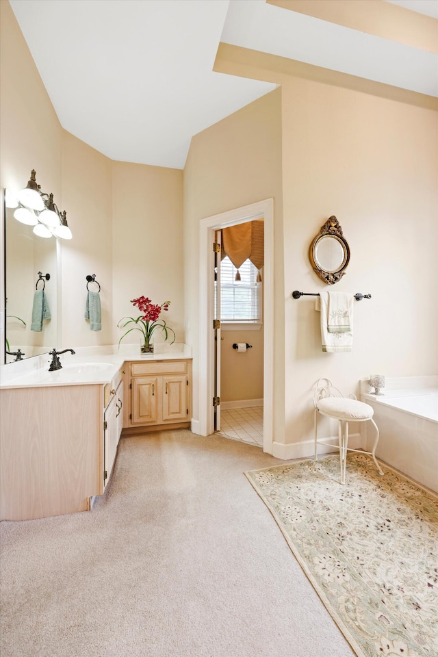 8207 Carriage Xing, Chattanooga, TN 37421 - full bathroom featuring vanity, a bath, vaulted ceiling, carpet flooring, and baseboards