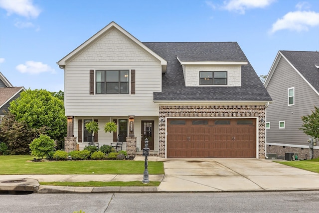 4867 Preserve Dr, Chattanooga, TN 37416 - view of front facade featuring brick siding, a front lawn, and a shingled roof
