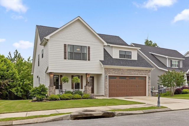 4867 Preserve Dr, Chattanooga, TN 37416 - view of front of home featuring a porch, a front lawn, driveway, a garage, and a shingled roof