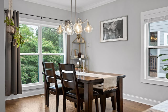4867 Preserve Dr, Chattanooga, TN 37416 - dining area featuring crown molding, dark wood finished floors, and baseboards