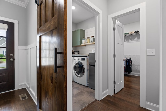 4867 Preserve Dr, Chattanooga, TN 37416 - laundry room featuring washer / clothes dryer, dark wood finished floors, ornamental molding, and a barn door