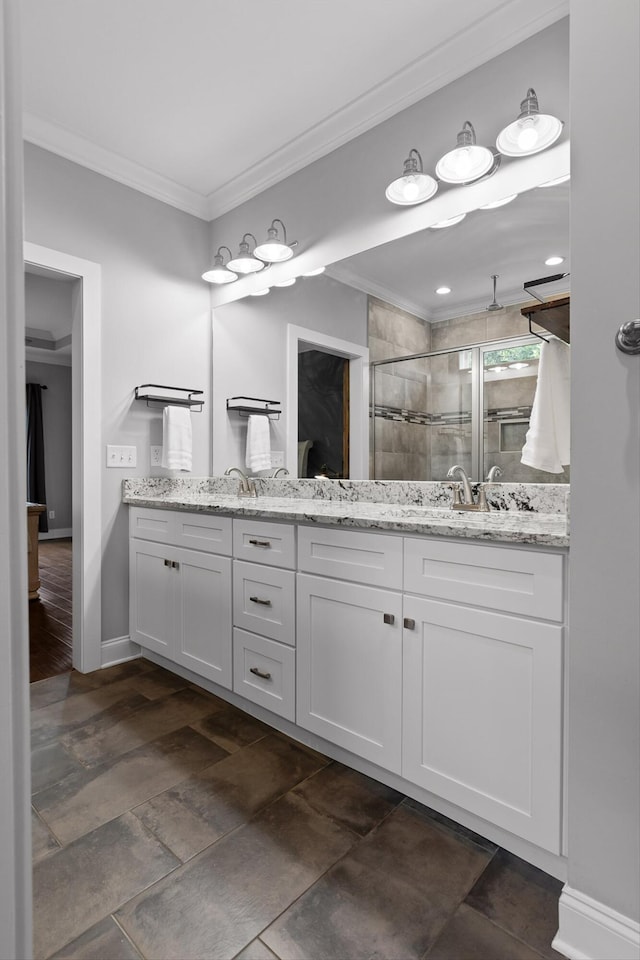 4867 Preserve Dr, Chattanooga, TN 37416 - bathroom featuring ornamental molding, a shower stall, double vanity, baseboards, and stone finish flooring