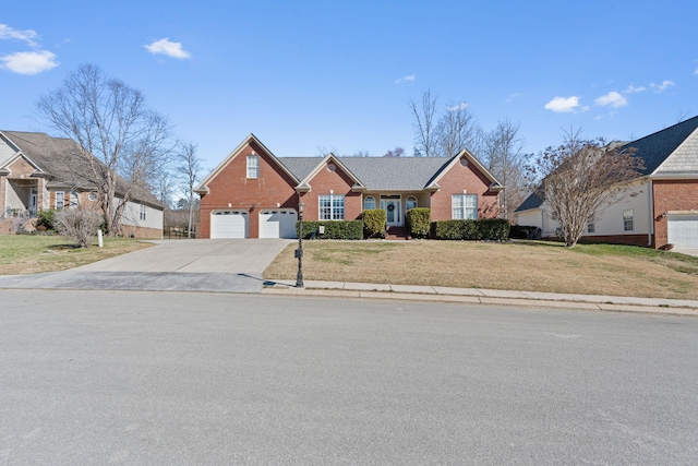 1549 Leighton Dr, Soddy Daisy, TN 37379 - traditional-style home with driveway, brick siding, and a front yard