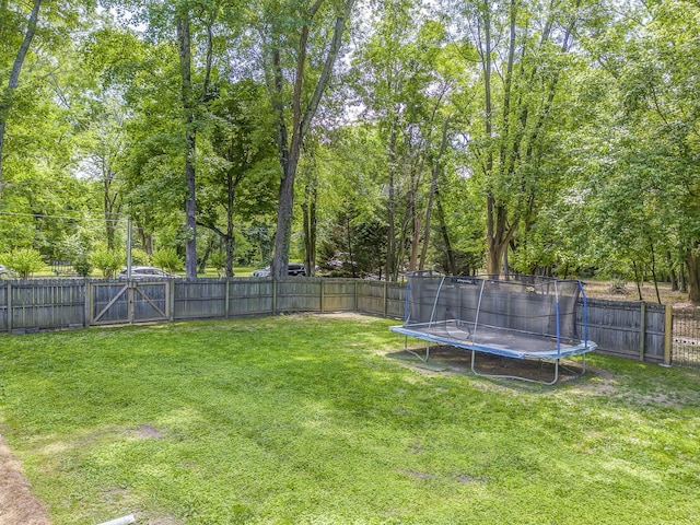 201 N Tibbs Rd, Dalton, GA 30720 - view of yard featuring a trampoline and a gate