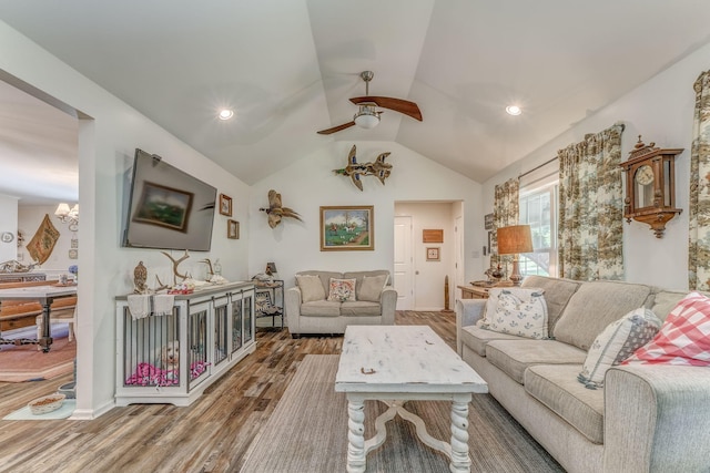 201 N Tibbs Rd, Dalton, GA 30720 - living area with wood finished floors, lofted ceiling, ceiling fan, and a chandelier