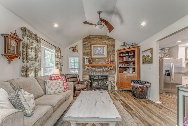 201 N Tibbs Rd, Dalton, GA 30720 - living area with ceiling fan, light wood finished floors, lofted ceiling, a fireplace, and baseboards