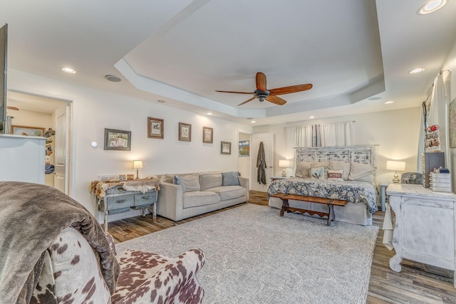 201 N Tibbs Rd, Dalton, GA 30720 - bedroom with a tray ceiling, wood finished floors, recessed lighting, and a ceiling fan