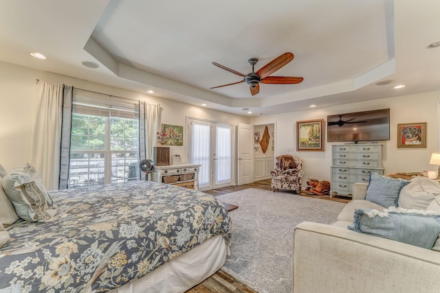 201 N Tibbs Rd, Dalton, GA 30720 - bedroom featuring a tray ceiling, wood finished floors, recessed lighting, access to exterior, and ceiling fan
