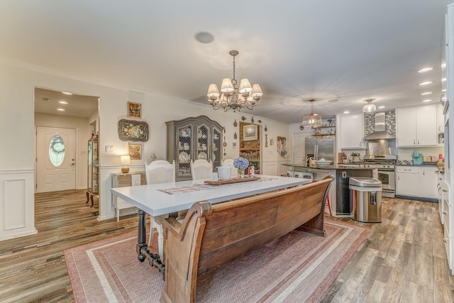 201 N Tibbs Rd, Dalton, GA 30720 - dining area featuring light wood finished floors, a chandelier, recessed lighting, a wainscoted wall, and ornamental molding