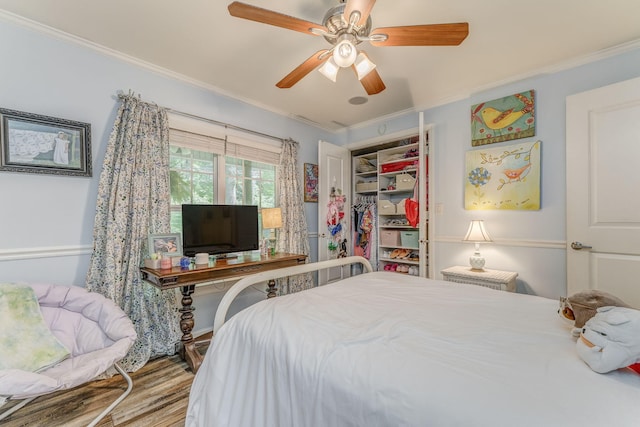 201 N Tibbs Rd, Dalton, GA 30720 - bedroom with crown molding, wood finished floors, a closet, and a ceiling fan
