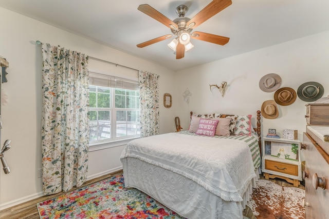 201 N Tibbs Rd, Dalton, GA 30720 - bedroom with wood finished floors, baseboards, and ceiling fan
