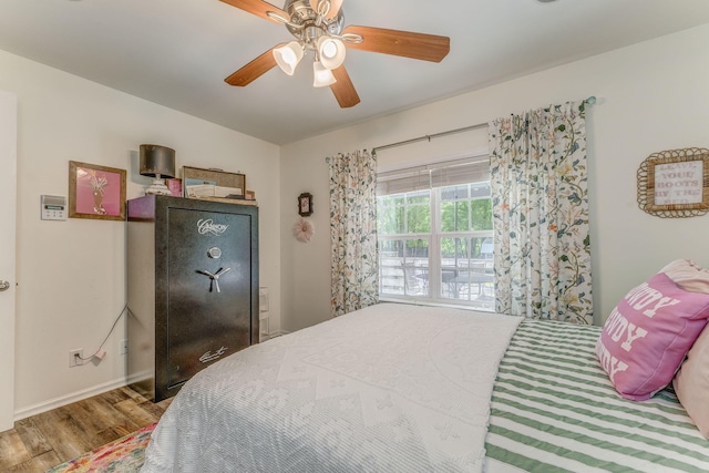 201 N Tibbs Rd, Dalton, GA 30720 - bedroom featuring wood finished floors, ceiling fan, and baseboards