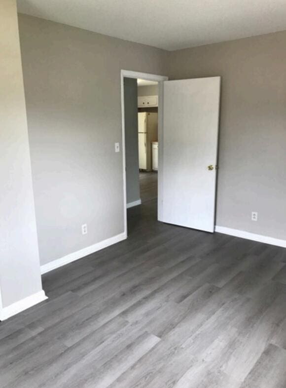 1202 Gadd Rd, Hixson, TN 37343 - empty room with baseboards and dark wood finished floors