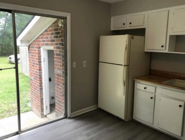 1202 Gadd Rd, Hixson, TN 37343 - kitchen featuring freestanding refrigerator, healthy amount of natural light, light wood-style flooring, and white cabinets
