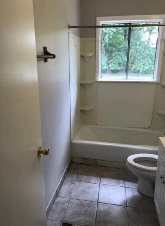 1202 Gadd Rd, Hixson, TN 37343 - bathroom featuring toilet, vanity, tub / shower combination, tile patterned floors, and baseboards