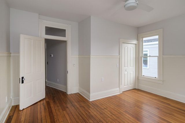 1501 Chamberlain Ave, Chattanooga, TN 37404 - unfurnished bedroom with a wainscoted wall, wood-type flooring, a closet, baseboards, and ceiling fan