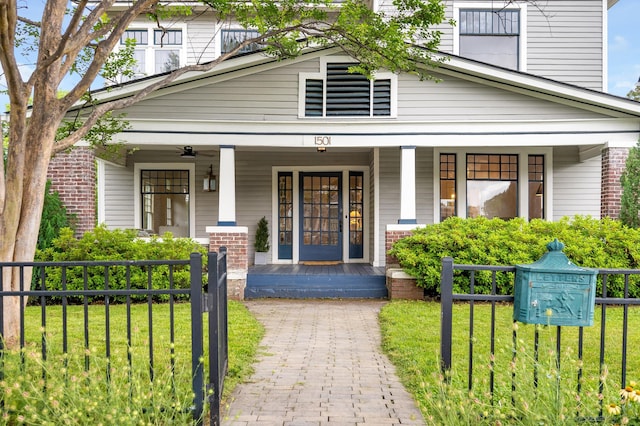 1501 Chamberlain Ave, Chattanooga, TN 37404 - view of front facade with covered porch, brick siding, and ceiling fan