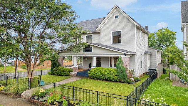 1501 Chamberlain Ave, Chattanooga, TN 37404 - view of front of property with a porch, central AC unit, and a shingled roof