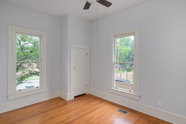 1501 Chamberlain Ave, Chattanooga, TN 37404 - empty room with healthy amount of natural light, light wood-style floors, a ceiling fan, and baseboards