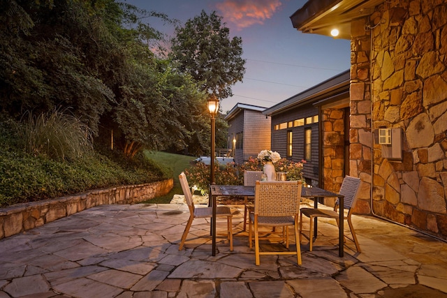 702 S Crest Rd, Chattanooga, TN 37404 - patio terrace at dusk with outdoor dining area and a patio