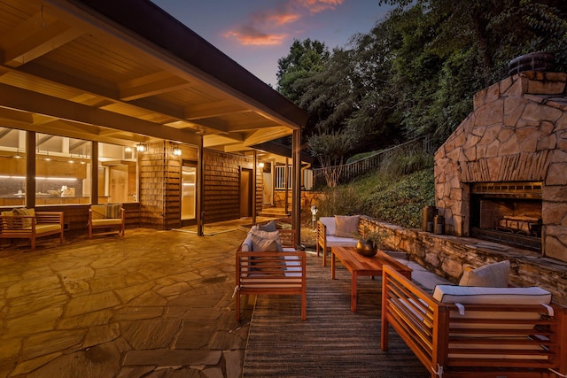 702 S Crest Rd, Chattanooga, TN 37404 - patio terrace at dusk with an outdoor living space with a fireplace and a patio area