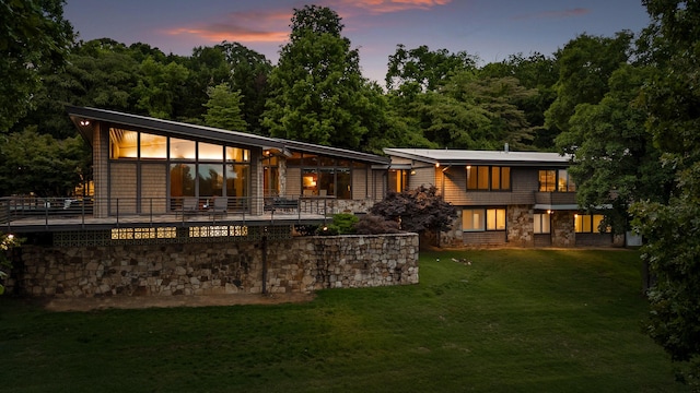 702 S Crest Rd, Chattanooga, TN 37404 - rear view of house with a lawn and stone siding