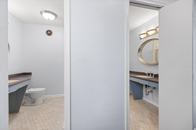 702 S Crest Rd, Chattanooga, TN 37404 - bathroom with toilet, a sink, and tile patterned floors