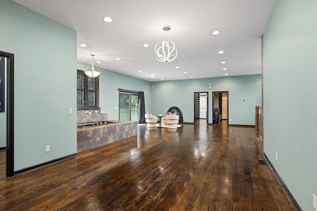 702 S Crest Rd, Chattanooga, TN 37404 - unfurnished living room with wood finished floors, recessed lighting, a chandelier, and baseboards