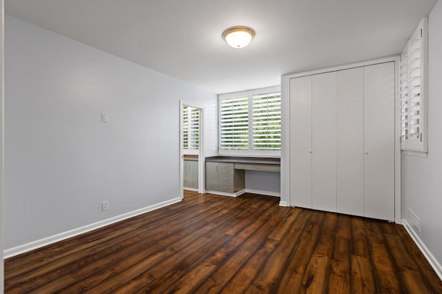 702 S Crest Rd, Chattanooga, TN 37404 - unfurnished bedroom featuring wood finished floors, baseboards, and a closet