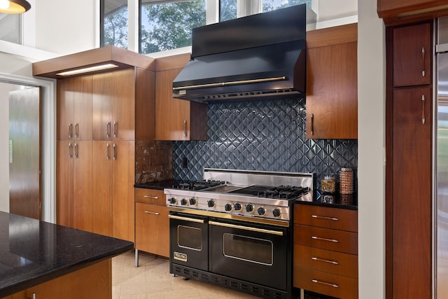 702 S Crest Rd, Chattanooga, TN 37404 - kitchen with double oven range, ventilation hood, backsplash, and brown cabinetry