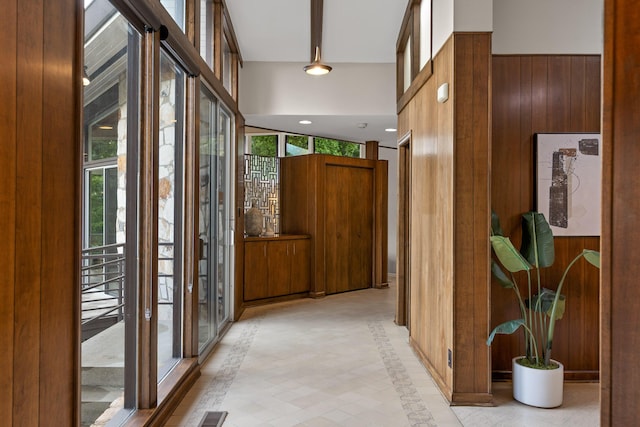 702 S Crest Rd, Chattanooga, TN 37404 - corridor featuring inlaid floor details, wood walls, and light tile patterned flooring