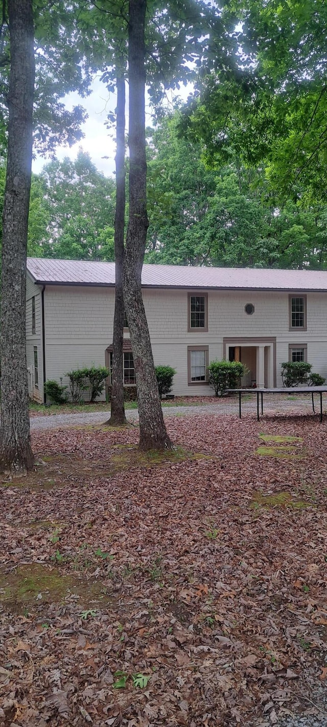 665 Scott Rd, Signal Mountain, TN 37377 - view of front facade with brick siding and view of wooded area