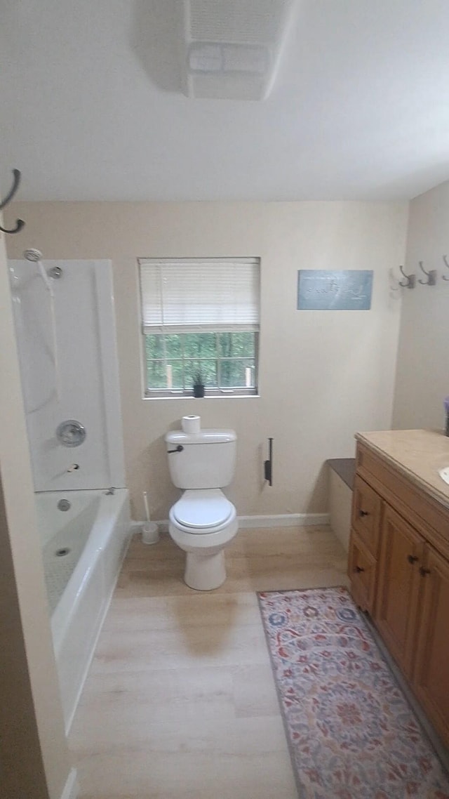 665 Scott Rd, Signal Mountain, TN 37377 - full bathroom with vanity, toilet, wood finished floors, shower / tub combination, and baseboards