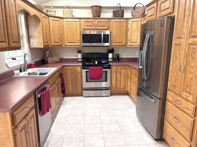 308 Bennie Camp Rd, Dunlap, TN 37327 - kitchen featuring appliances with stainless steel finishes, a sink, brown cabinets, and dark countertops