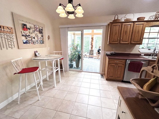 308 Bennie Camp Rd, Dunlap, TN 37327 - kitchen with dishwasher, a sink, dark countertops, a chandelier, and brown cabinets