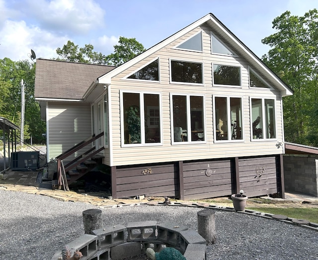 308 Bennie Camp Rd, Dunlap, TN 37327 - view of front of home featuring a fire pit, a sunroom, and cooling unit