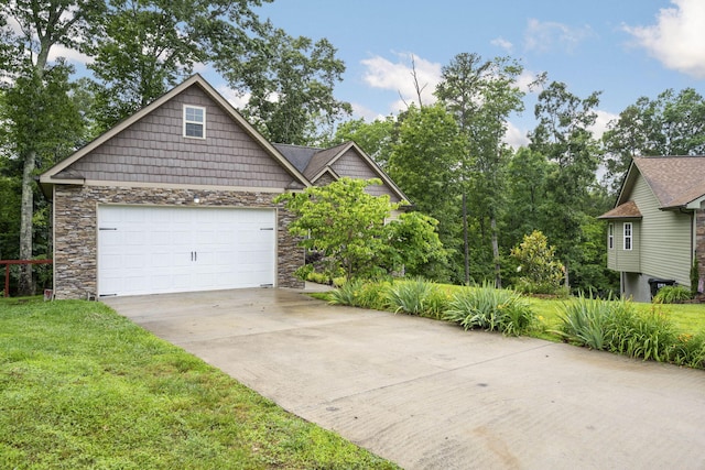 1804 Staghorn Dr, Soddy Daisy, TN 37379 - view of front facade featuring stone siding, concrete driveway, a garage, and a front lawn