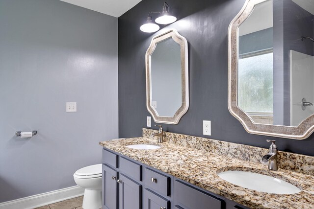 1804 Staghorn Dr, Soddy Daisy, TN 37379 - bathroom featuring toilet, double vanity, tile patterned flooring, and baseboards