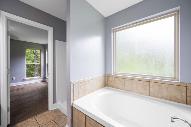 1804 Staghorn Dr, Soddy Daisy, TN 37379 - bathroom featuring a garden tub, baseboards, and tile patterned floors