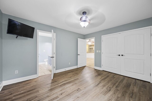 1804 Staghorn Dr, Soddy Daisy, TN 37379 - unfurnished bedroom featuring wood finished floors, baseboards, a closet, and ensuite bath