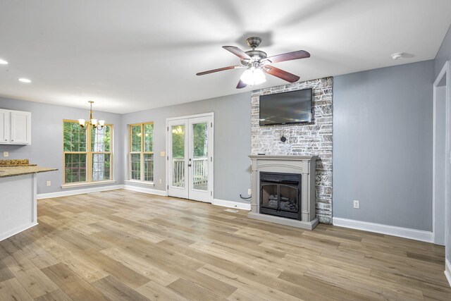 1804 Staghorn Dr, Soddy Daisy, TN 37379 - unfurnished living room featuring a chandelier, ceiling fan, plenty of natural light, light wood-type flooring, and recessed lighting