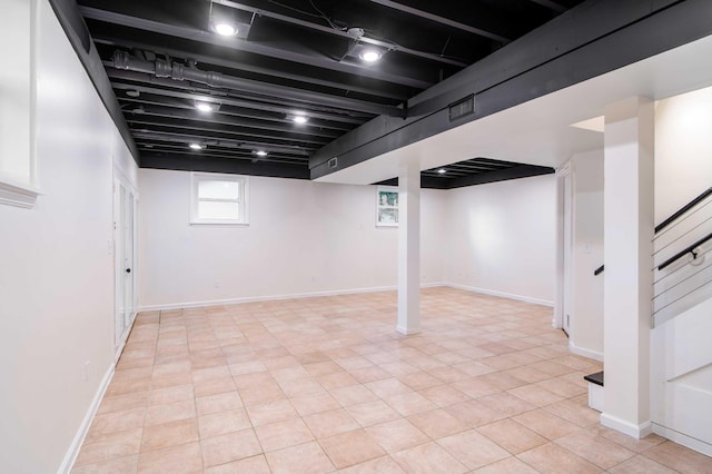 1306 Phyllis Ln, Chattanooga, TN 37421 - below grade area with stairs, baseboards, and light tile patterned flooring