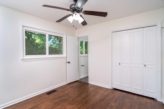 1306 Phyllis Ln, Chattanooga, TN 37421 - unfurnished bedroom featuring dark wood-style flooring, baseboards, a closet, and ceiling fan
