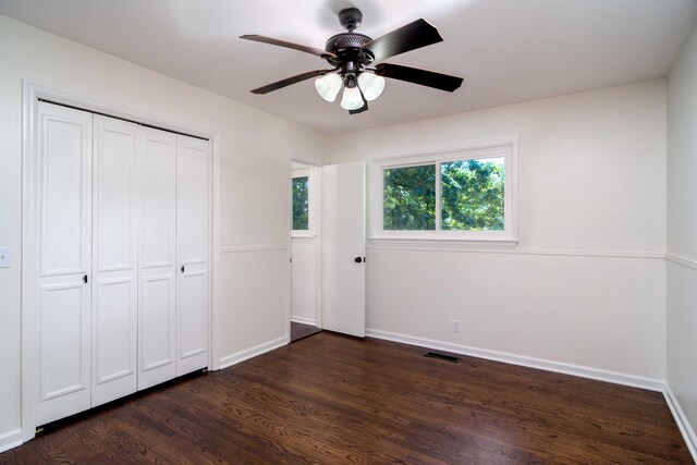 1306 Phyllis Ln, Chattanooga, TN 37421 - unfurnished bedroom featuring dark wood-style floors, baseboards, a closet, and ceiling fan